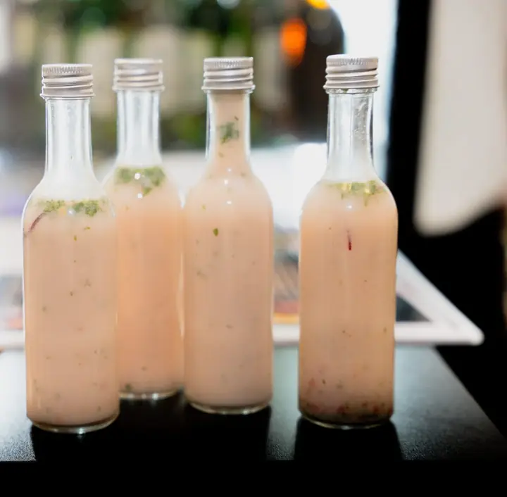 Bottles of house-made leche de tigre